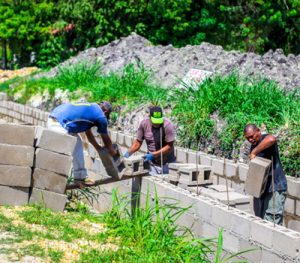 Local teams cement drains.
